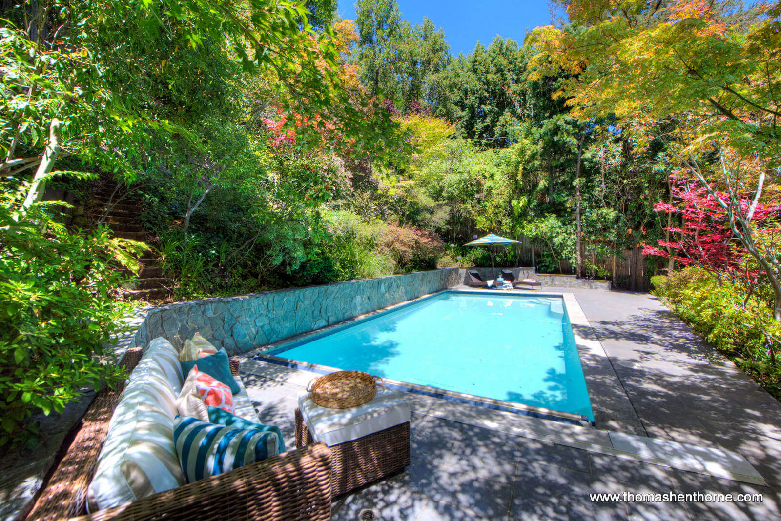 2 Foothill Road San Anselmo 41 daytime shot of pool with seating area in foreground and colorful leaves