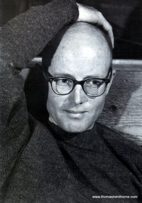 Mark Mills wearing glasses with hand on his head
