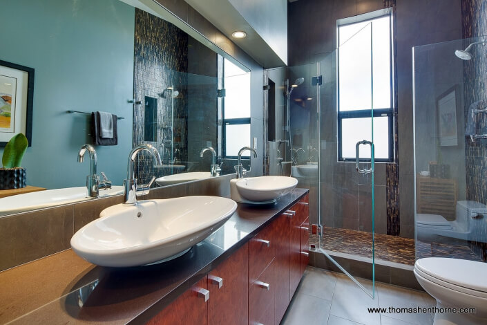 124 Lily Street (16 of 46) Master bathroom with dual vessel sinks and glass enclosed shower with view