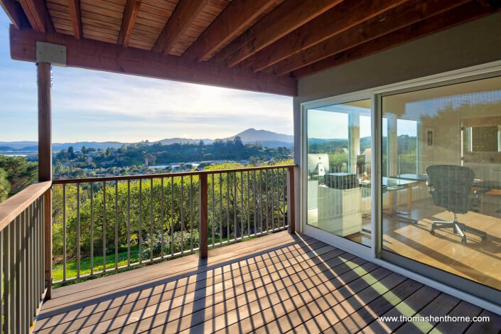 Wood deck off office with sliding glass doors