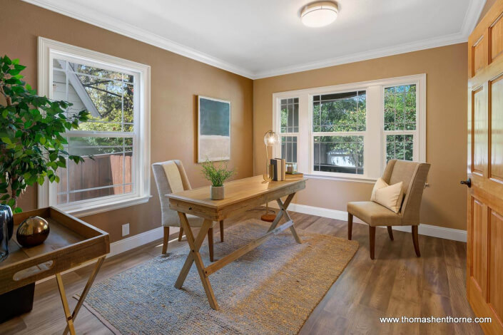 Home office with hardwood floors and rustic desk