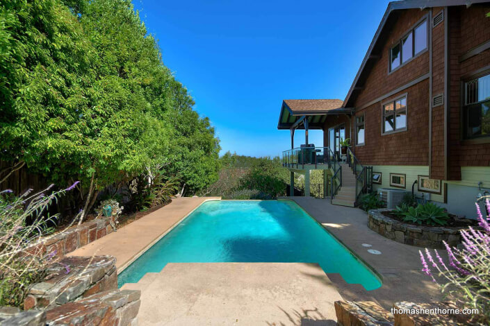 Swimming pool and house with shingles