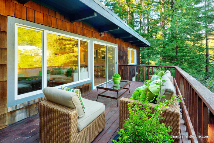 Outdoor deck with sofa and chairs