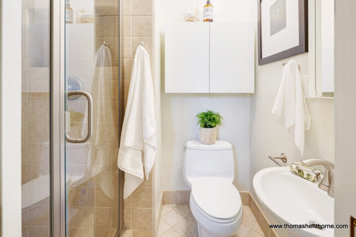 bathroom with brushed nickel fixtures and shower