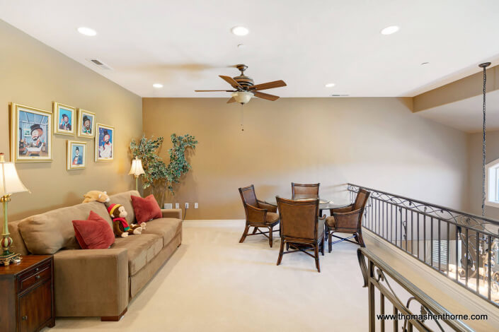 611-Fairway-Dr-Novato 49 of 108 upstairs landing with table and chairs and sofa