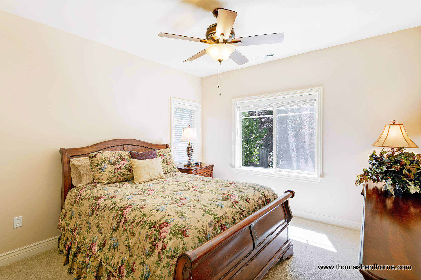 611-Fairway-Dr-Novato 53 of 108 Bedroom with sleigh bed and two windows and ceiling fan