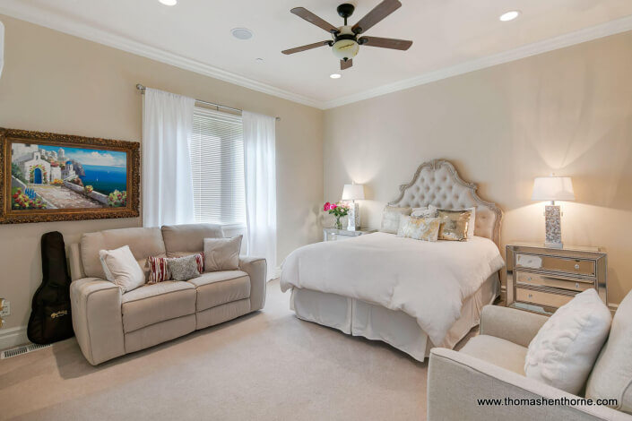 bedroom with love seat and chair