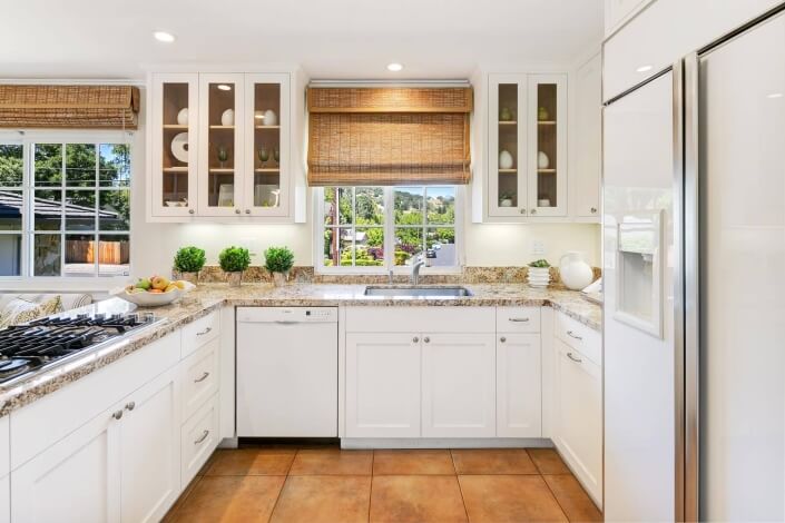 kitchen with stone countertops and tile floor