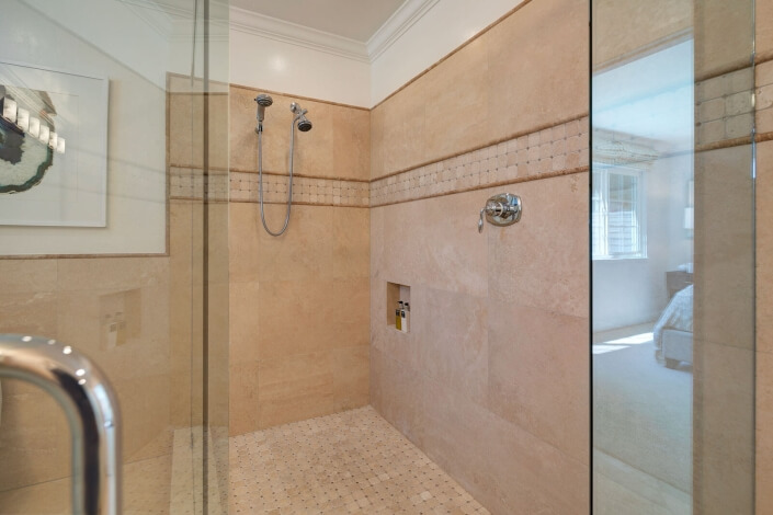 primary bathroom walk in shower with glass surround