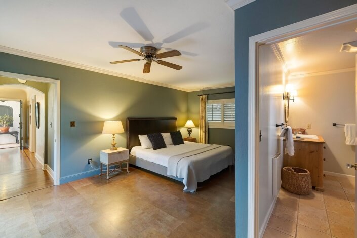 Primary bedroom with view of bathroom and hallway