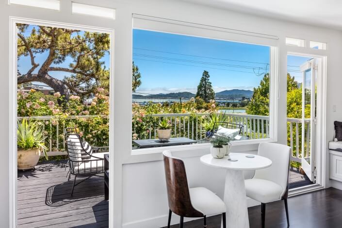 Interior table for two with view of bay outside