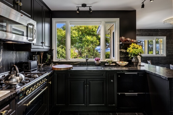 Kitchen with dark cabinetry