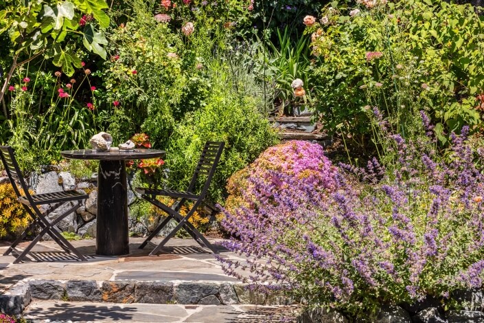 Cafe table with flowers in foreground