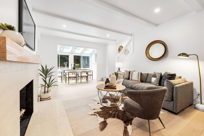 living room with fireplace and wood floors