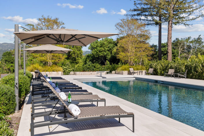 chaise lounges by pool