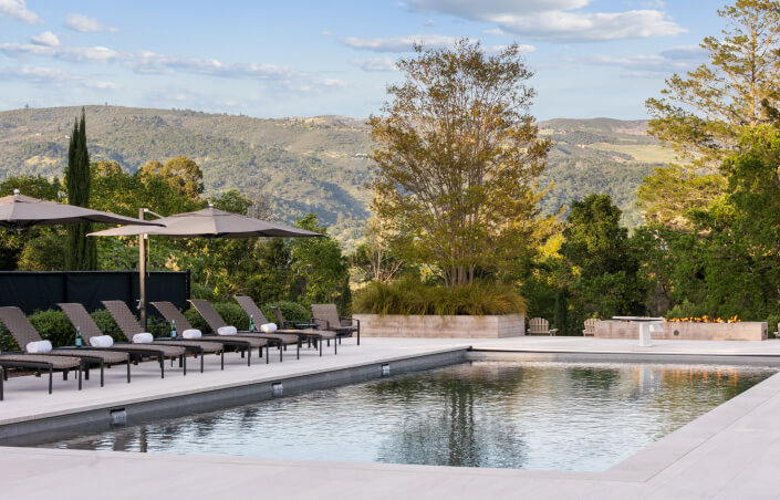chaise lounges by pool