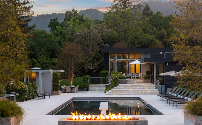 fire feature and pool at dusk