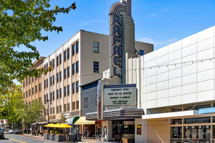 Rafael Theater in SanRafael, CA street scene with cafes and shops and marquee