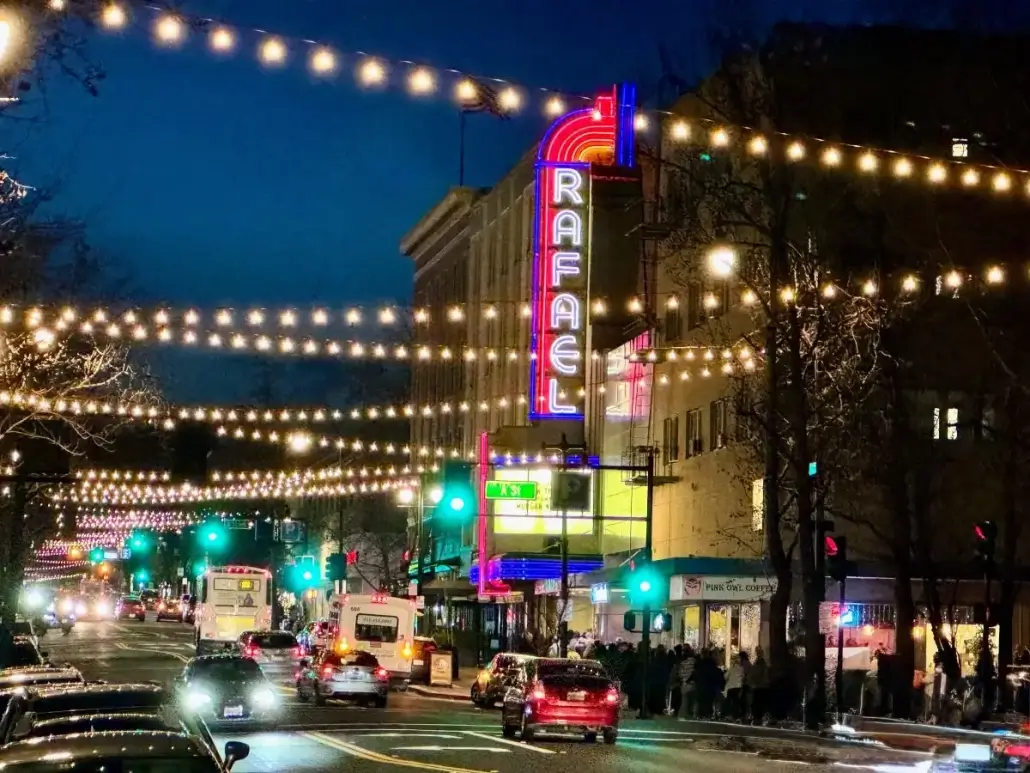 Downtown San Rafael street scene at night with Rafael Theater